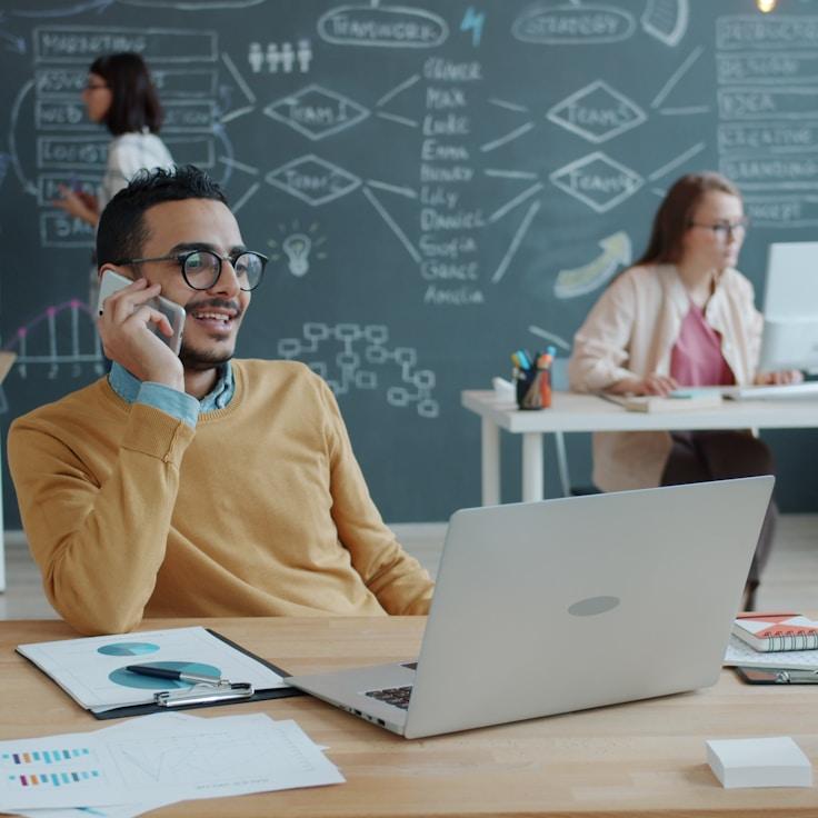 Mobile app project planning workspace with devices and development tools